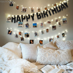 KatchOn backdrop pairs with balloons for cohesive black-themed party décor.