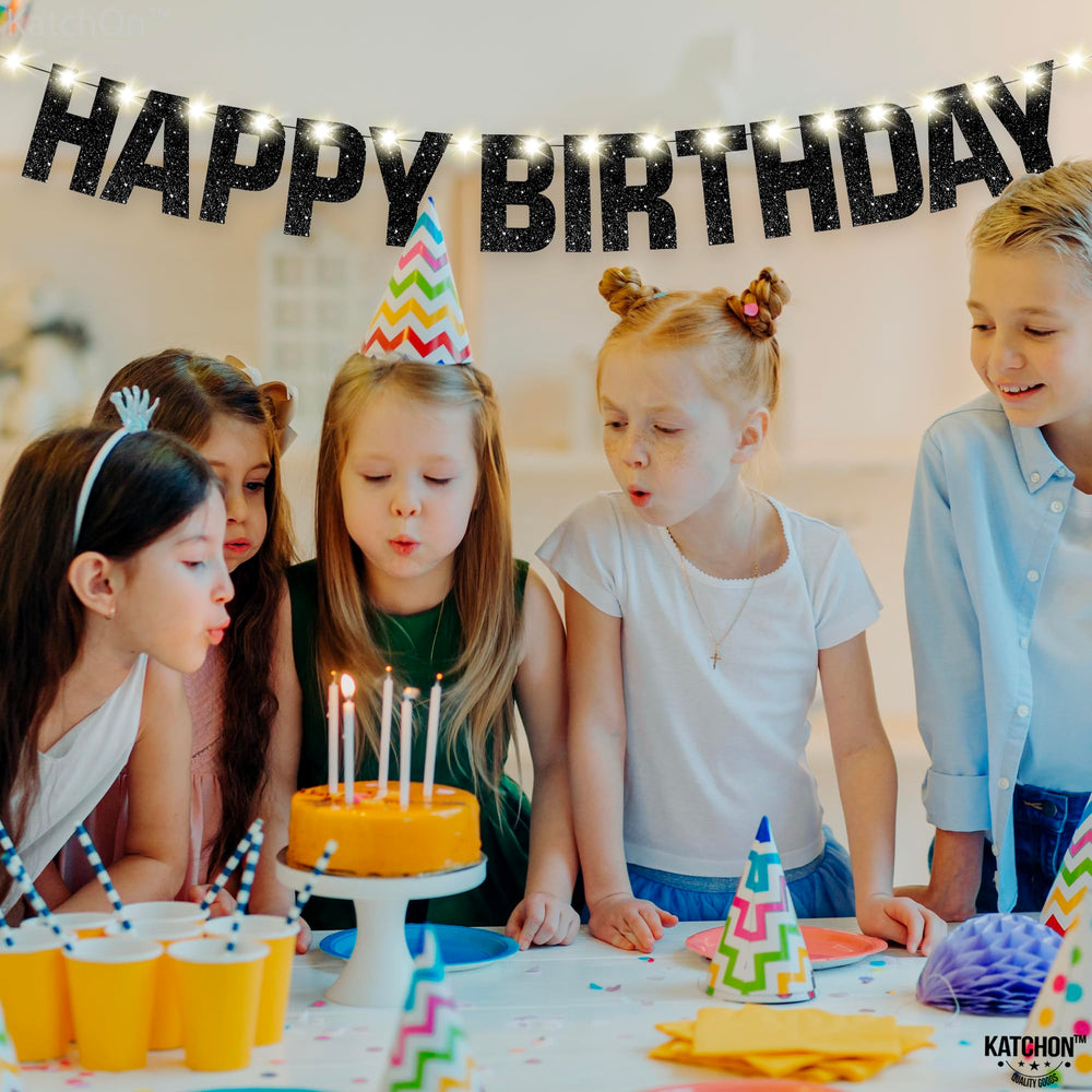 KatchOn Glitter Black Happy Birthday banner ideal for living room or party venues as festive decor.