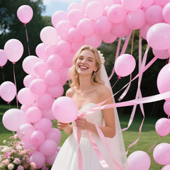 KAWKALSH balloon garland idea in pink to elevate party aesthetics.