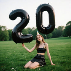 Kelfuoya 40-inch black number 2 balloon hung on wall for backdrop