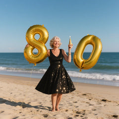 Kelfuoya 80th birthday foil balloon serves as a striking milestone centerpiece.