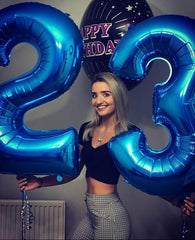 Kelfuoya birthday backdrop with large navy blue number 3 balloon.