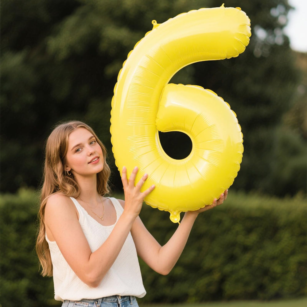 Kelfuoya macaron yellow number 6 foil balloon enhances photo moments.