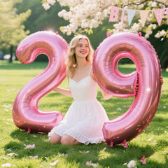 Kelfuoya pink number 9 balloon backdrop creates dramatic visual impact.