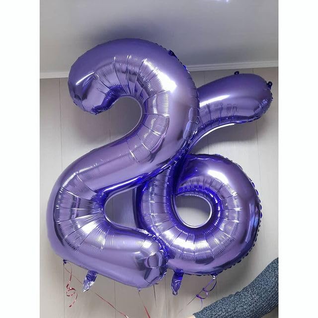 Kelfuoya purple number 9 foil balloon creates striking celebration backdrop.