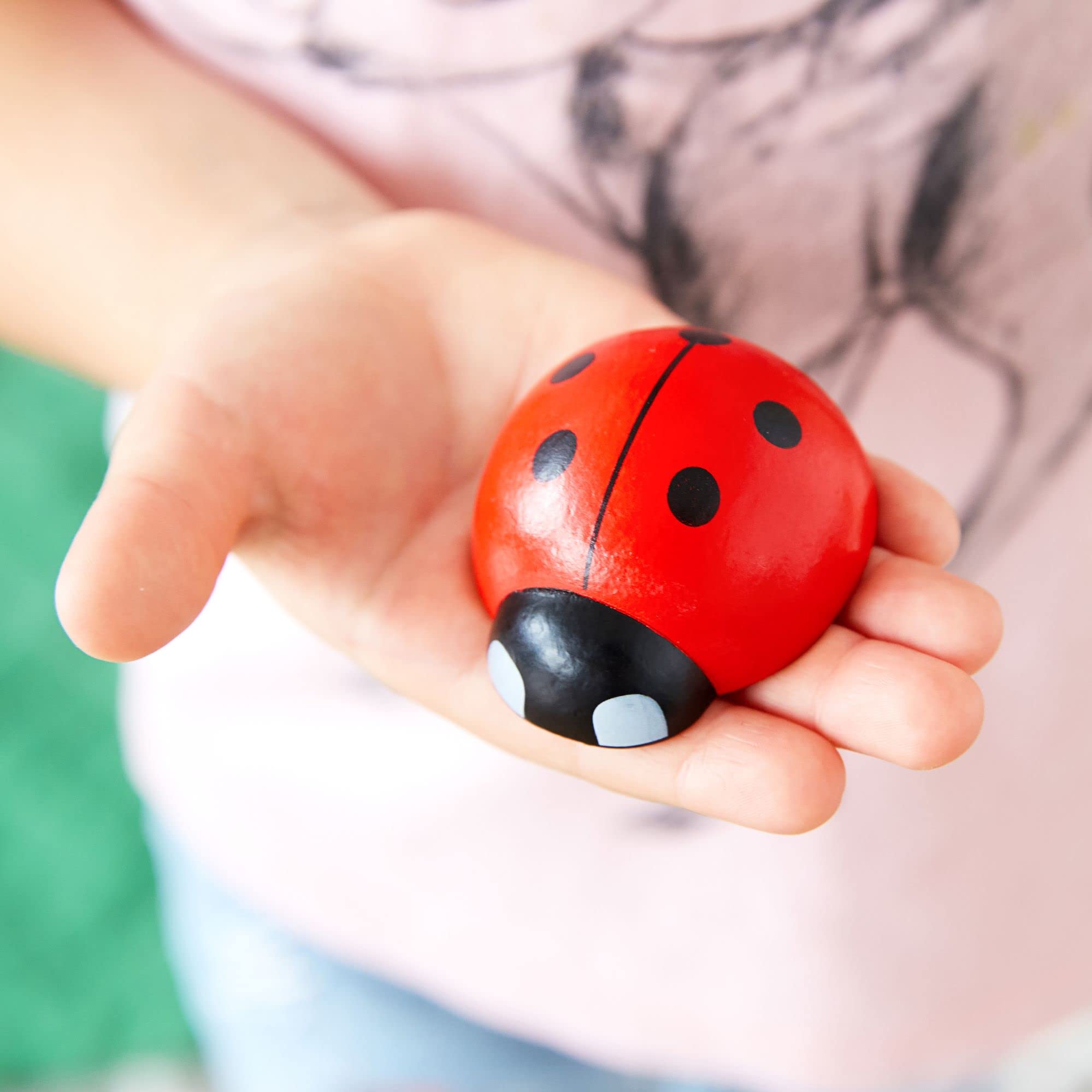 Kenley Felt jar with detachable flowers for interactive storage.