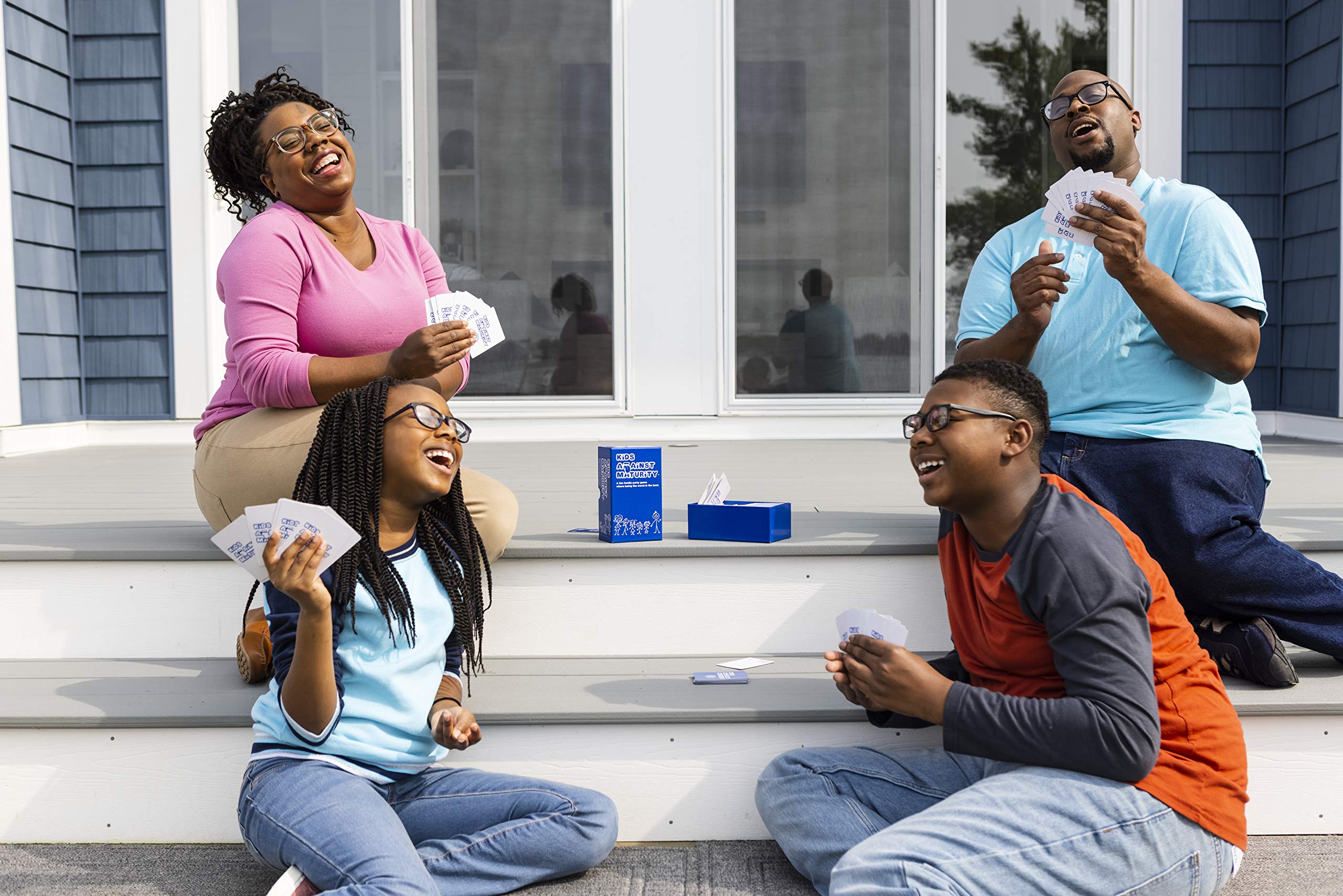 Family game night scene showing smiles and laughter with the game