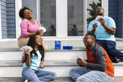 Family game night scene showing smiles and laughter with the game