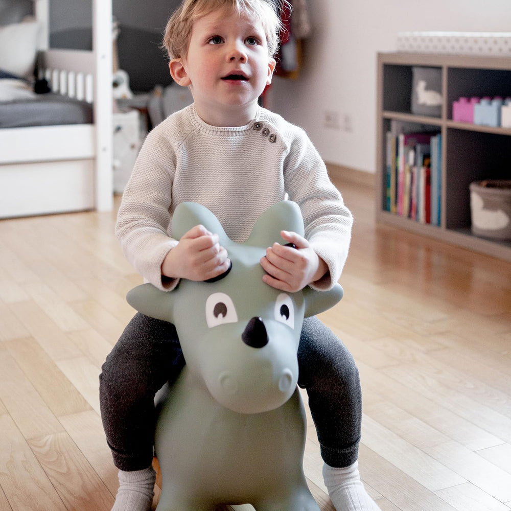 Kindsgut Dino Hopper viewed from the side showing secure seat.
