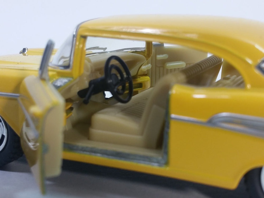 KiNSMART Bel Air's rubber tires and chrome accents enhance realism on display.