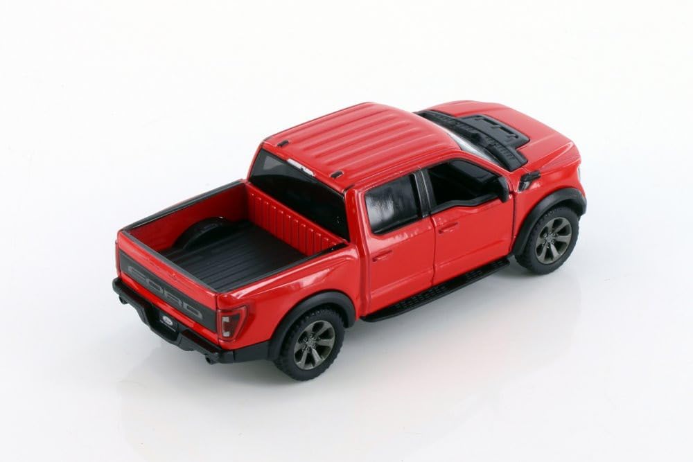 KiNSMART Ford F-150 Raptor 5-inch blue die-cast model with pullback action.