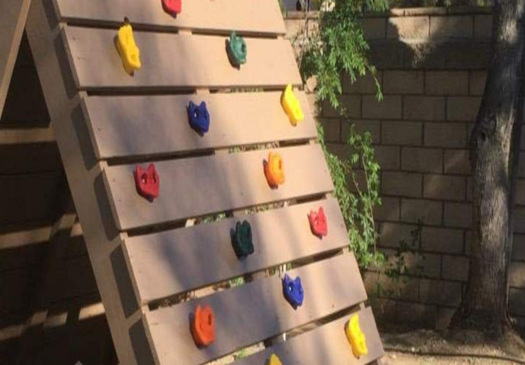 KINSPORY kids exploring a safe climbing wall boosts coordination and confidence.