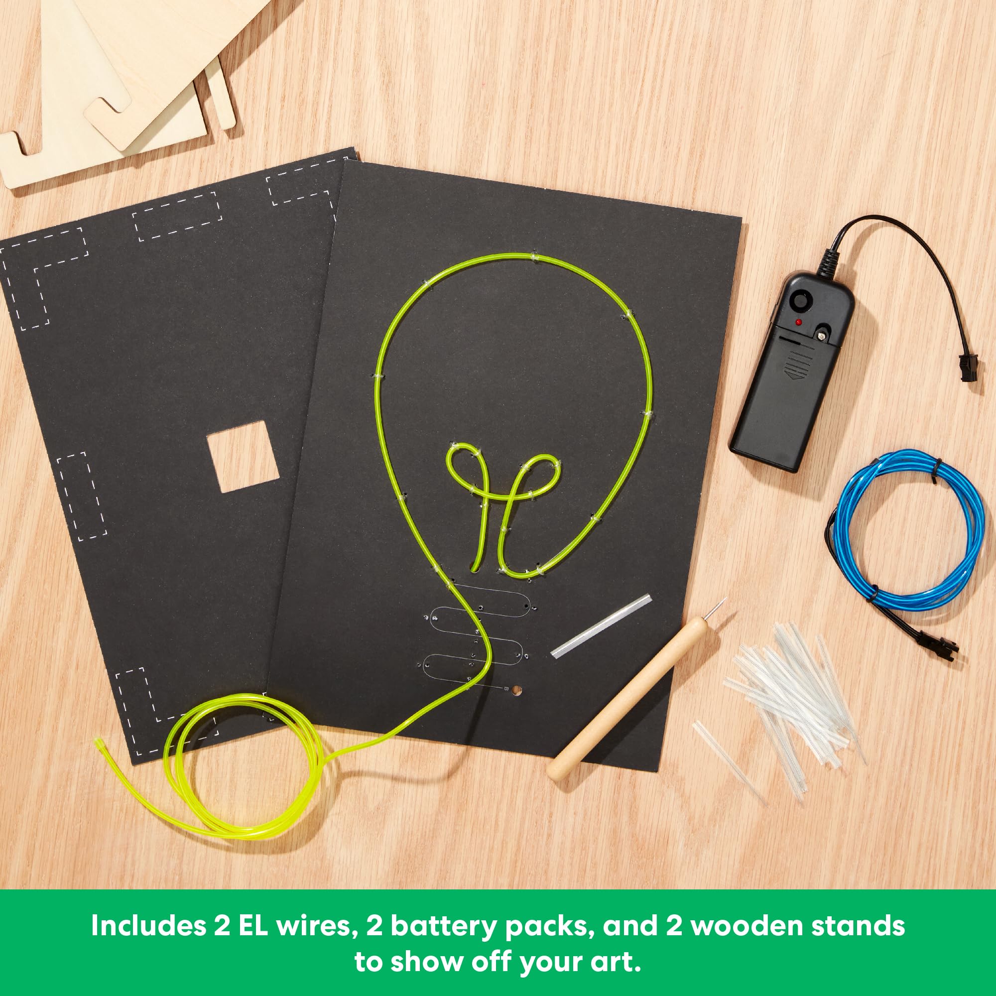 KiwiCo Light-Up Wire Art Kit battery packs power two neon signs for portable use.