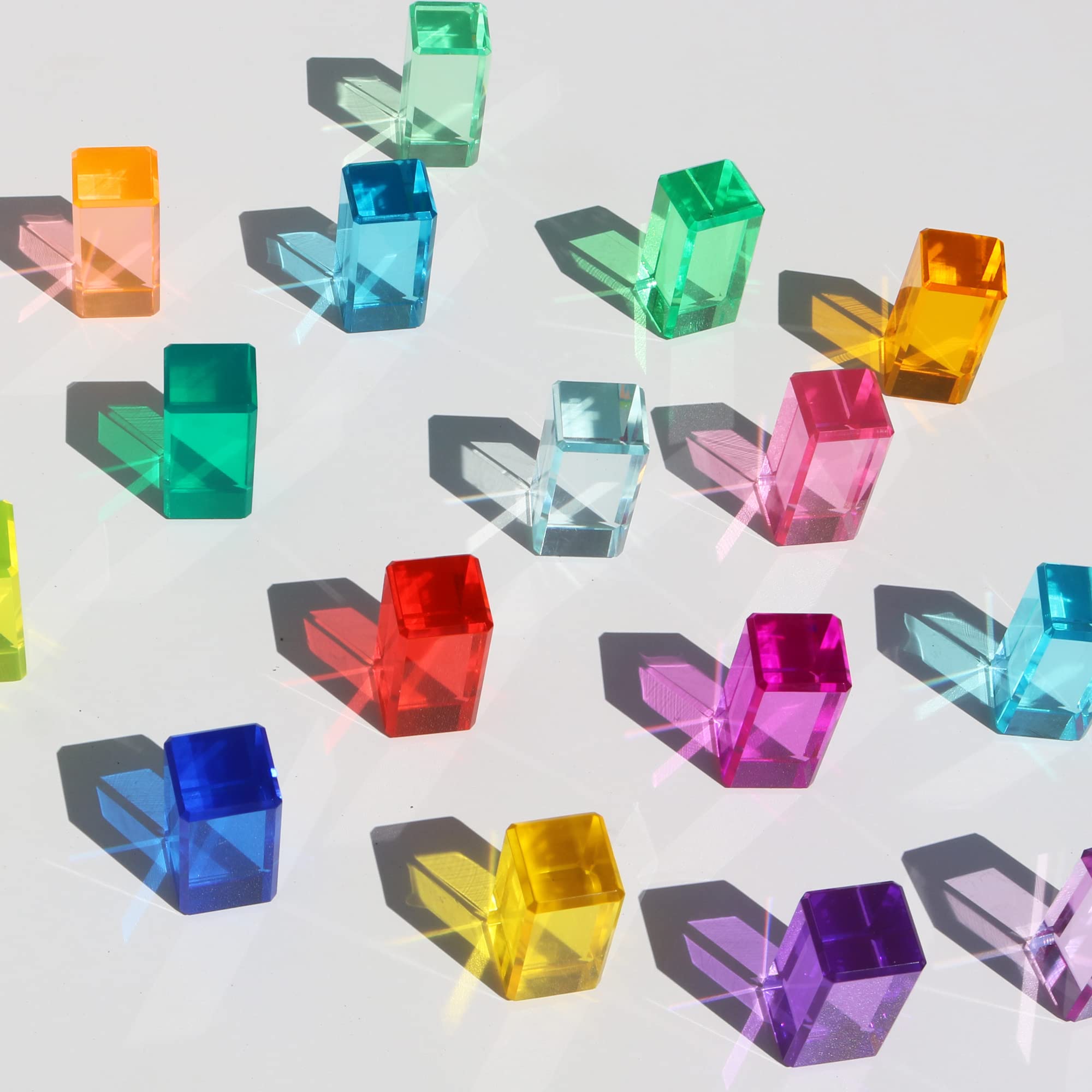 KOAICS Rainbow Crystal Strip Blocks glow under light for shadow play on a light table