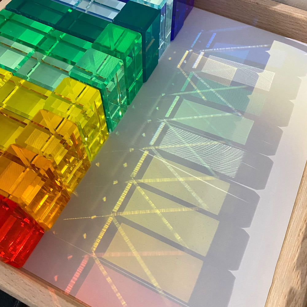 KOAICS Rainbow Crystal Strip Blocks beside a window showing natural light silhouettes