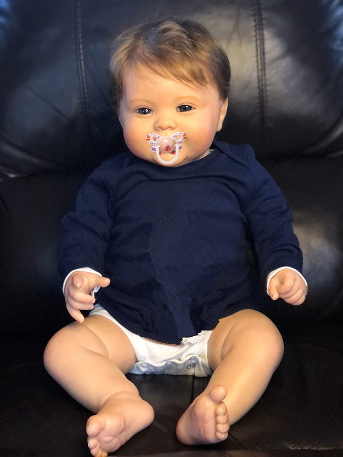 KOKOMANDY 24-inch reborn doll face close-up showing warm, lifelike features for cuddling