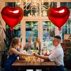 Kortes desk and bed decor with red heart balloons