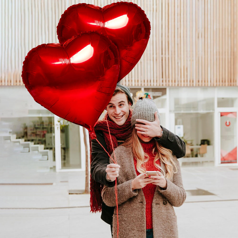 Kortes red heart balloon on wall for romantic ambiance