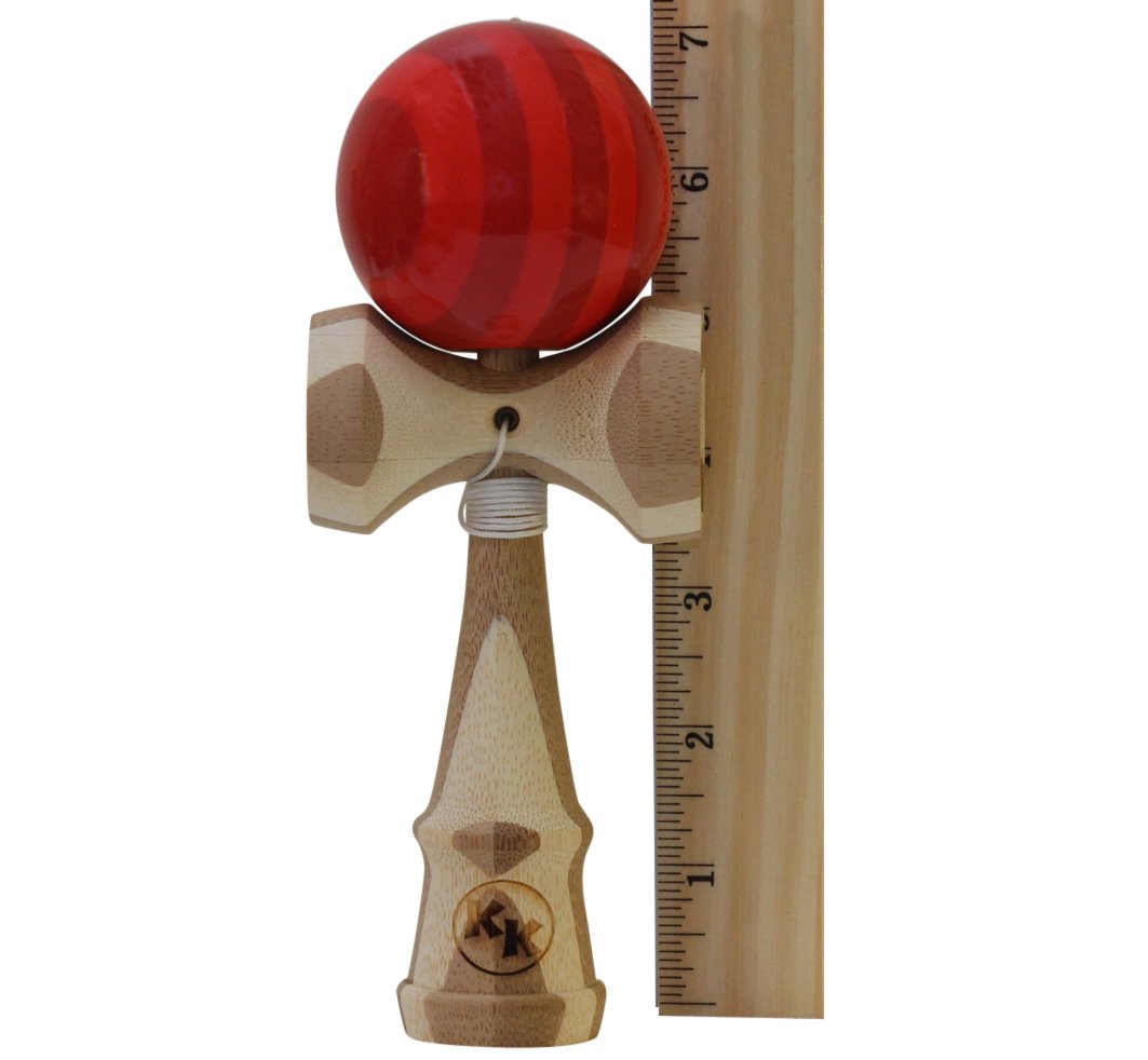 Kotaro Pro Bamboo Kendama in hand during trick practice highlighting balanced feel.