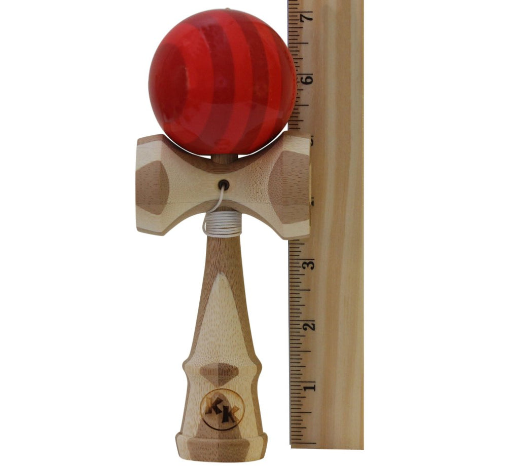 Kotaro Pro Bamboo Kendama in hand during trick practice highlighting balanced feel.