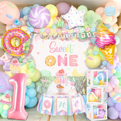 Kriyokiaa Sweet One kit backdrop for vibrant baby girl's first birthday photos.
