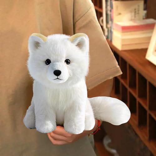 KUUDESOXX Arctic Fox plush on bed adds warmth to decor.