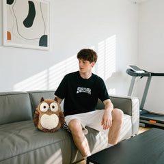 KUUDESOXX Owl plush toy displayed on shelf adds warmth