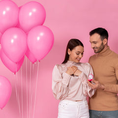 KUULBELA pink balloons on a party display with safety and setup guidance