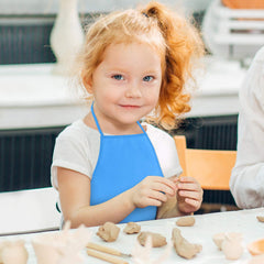 KUUQA durable reusable apron for classroom environments and busy homes.