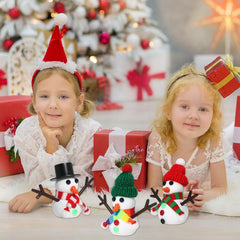 LAHAND hats and scarves add personality to each frosty figure.