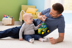 Lamaze tractor toy supports motor skills as babies explore textures and squeeze.