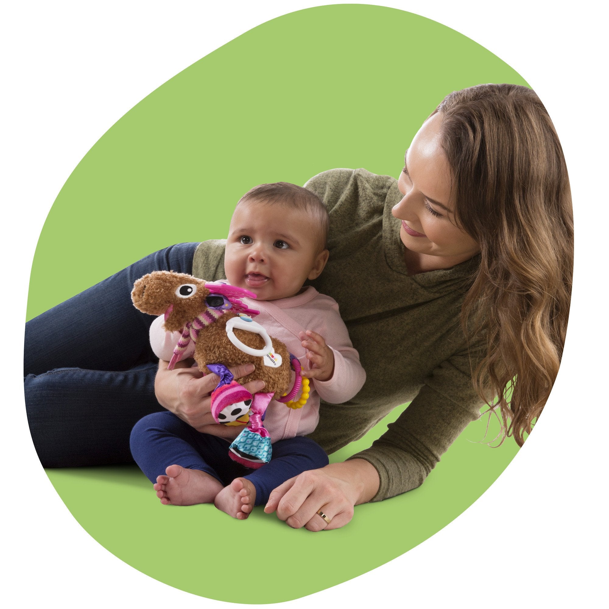 Lamaze Muffin squeaker tummy sparks auditory interest for interactive play.