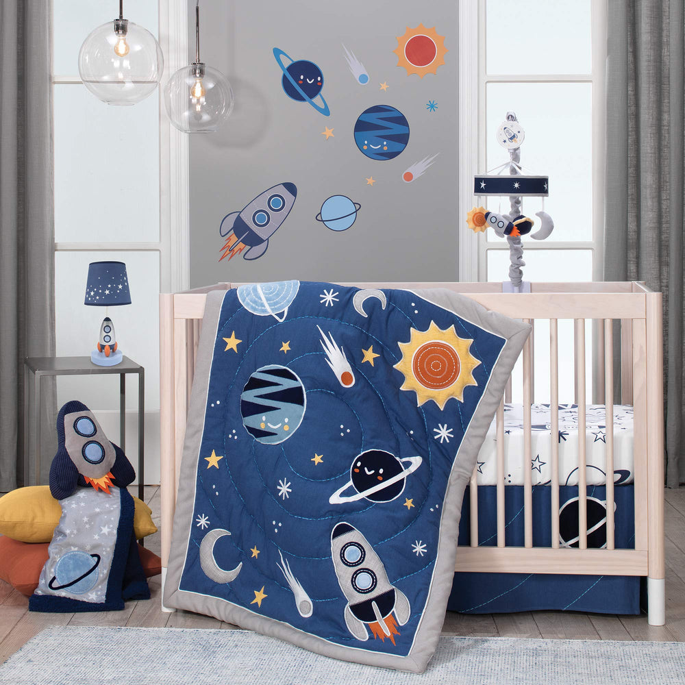 Lambs & Ivy Milky Way rocket ship pillow colorway with orange accents