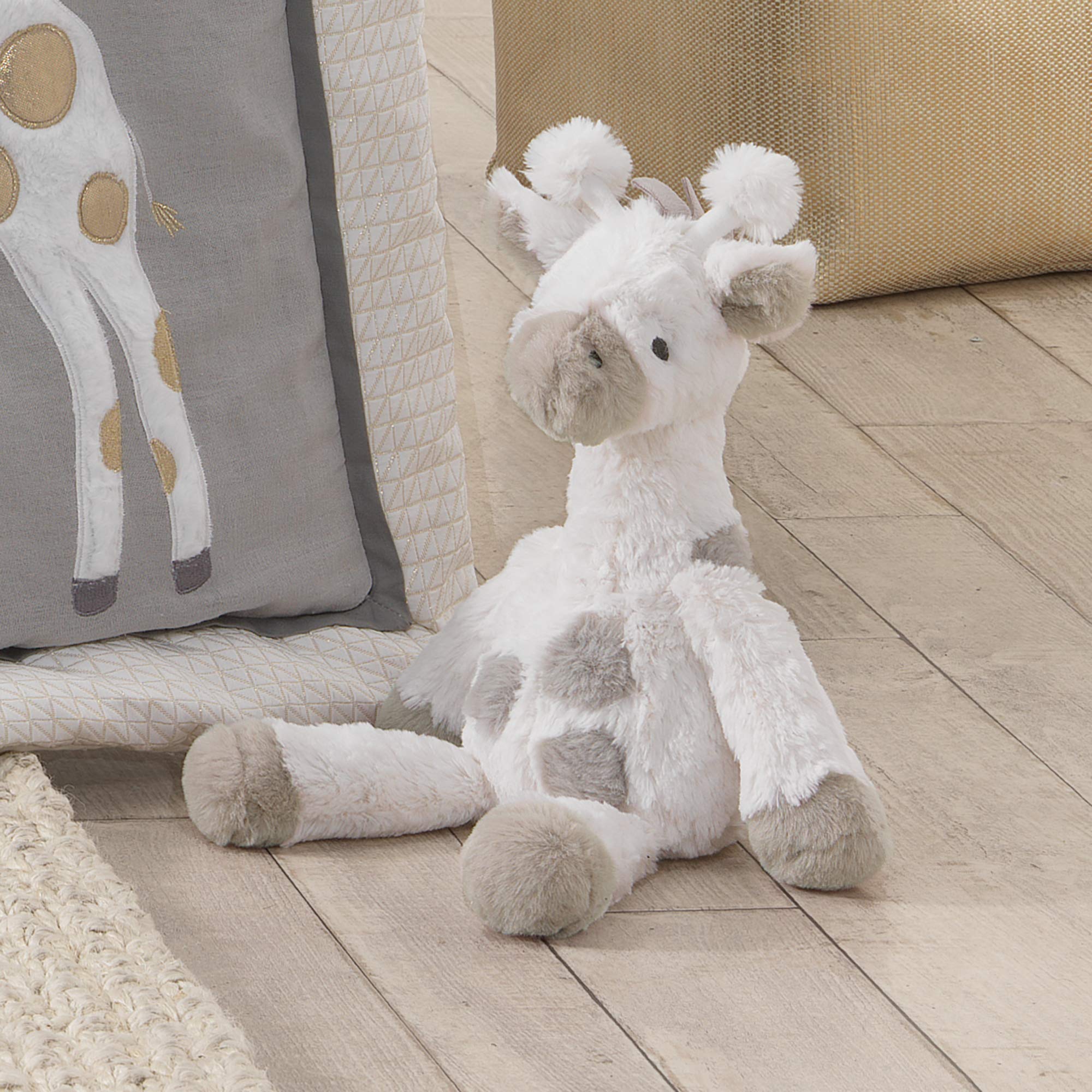 Lambs Ivy Millie cuddling pose, ideal for nap times and comforting play.