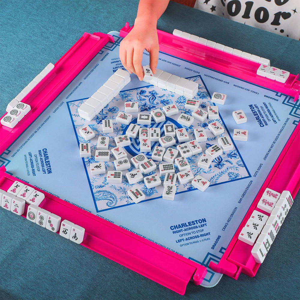 LaRandom four-player mahjong racks on a table ready for play