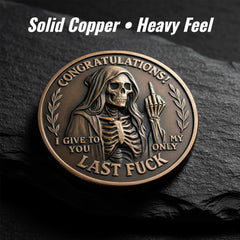 Last Fuck to Give coin side A with engraved motto and skull.