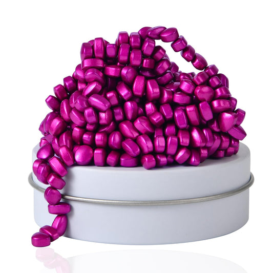 LCVUUK Rose Red ferrite rocks on a desk for focus and tactile play.