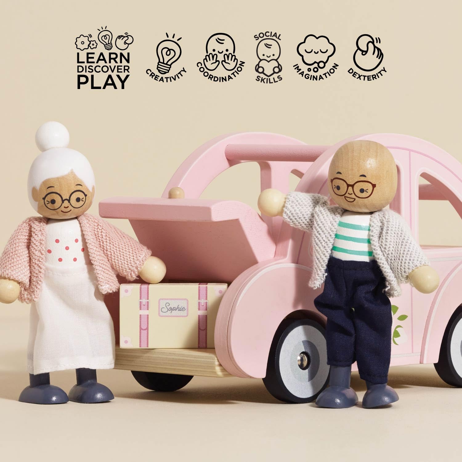 Side view of Sophie's pink car encouraging tactile, hands-on play.