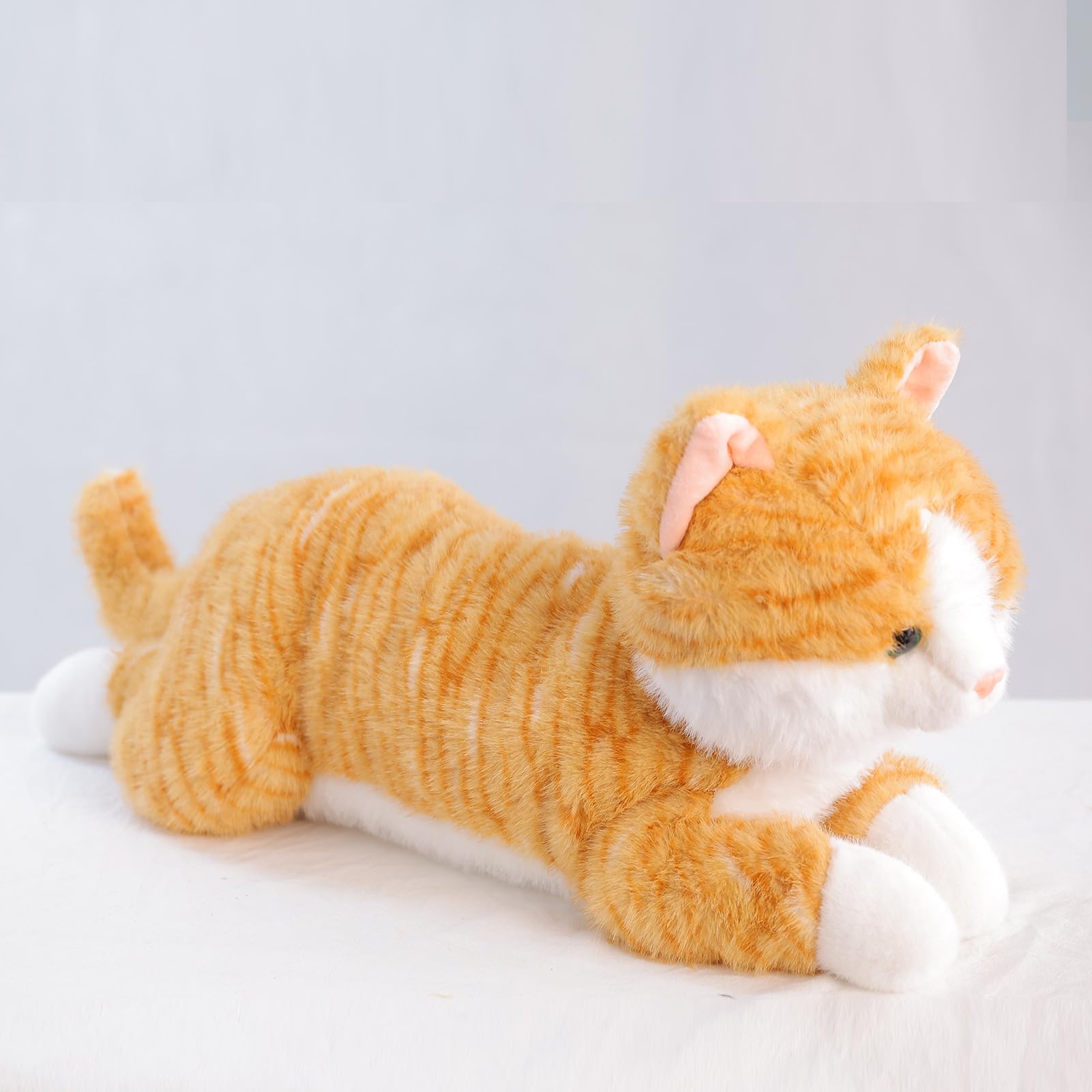 Leahaoe large weighted cat as decorative orange plush piece.