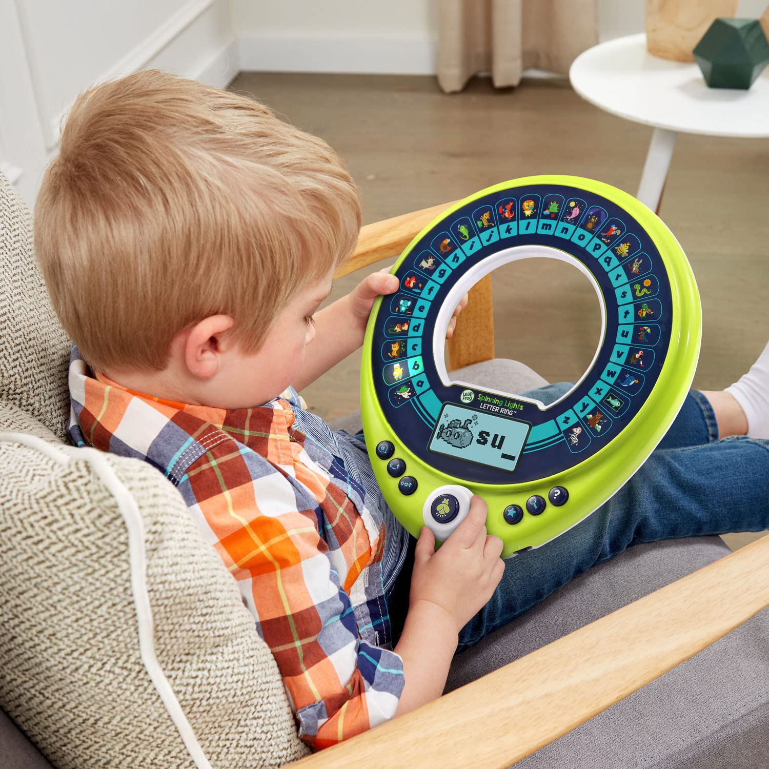 LeapFrog Spinning Lights Letter Ring supports spelling practice with interactive word-building.