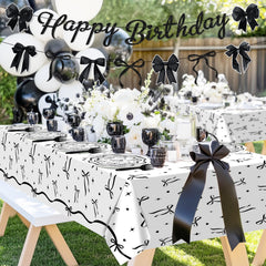 Lecheme Black Bow party scene indoors with monochrome styling