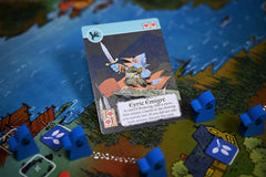 Leder Games Root Exiles and Partisans deck box and cards shown for table-ready play.
