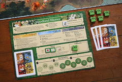 Player aids and trackers help orchestrate the woodland contest.