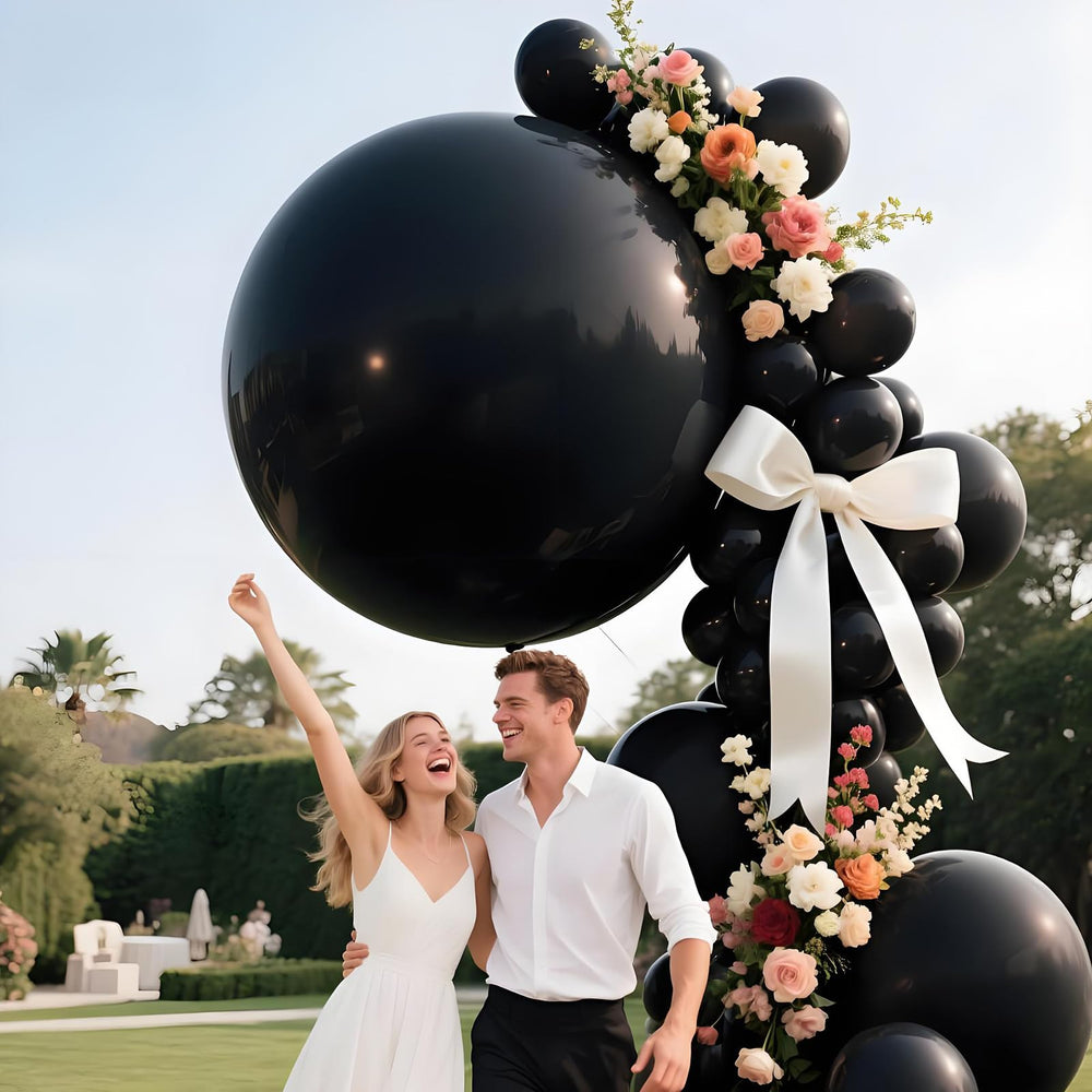 LEEZZIZZ wedding or anniversary decor with oversized balloons for festive ambiance.