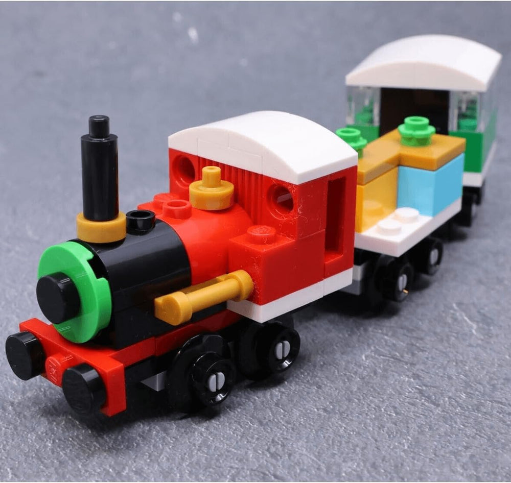 LEGO 30584 Winter Christmas Train build-in-action on a coffee table