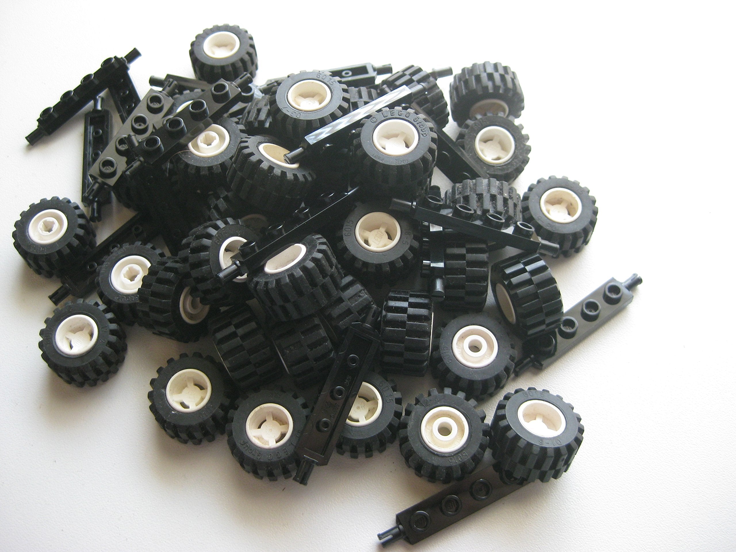 LEGO City wheel assembly showing 40 black tires and 40 white hubs for bright, consistent styling.