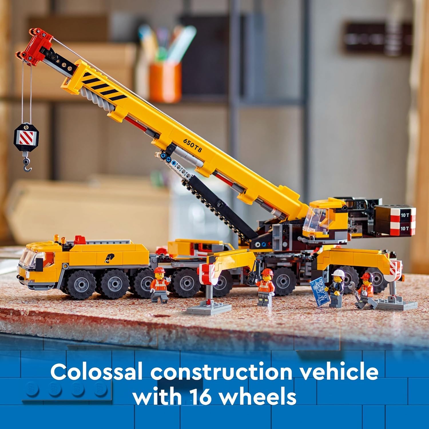 LEGO City yellow mobile construction crane with extended boom showing reach for construction scenes