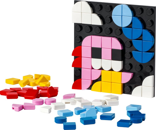 LEGO DOTS Adhesive Patch 41954 being applied to a notebook cover for quick customization.