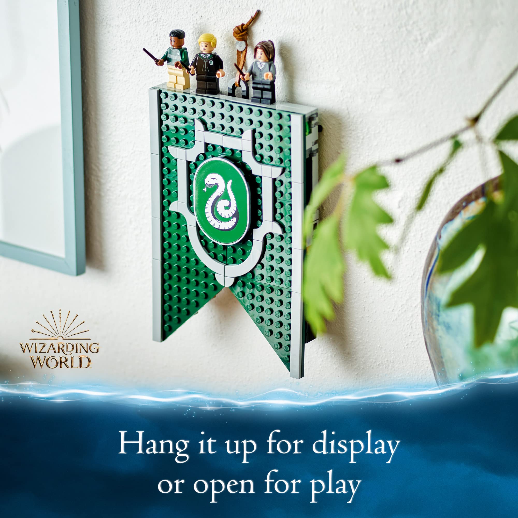 Draco Malfoy minifigure included with the Slytherin banner