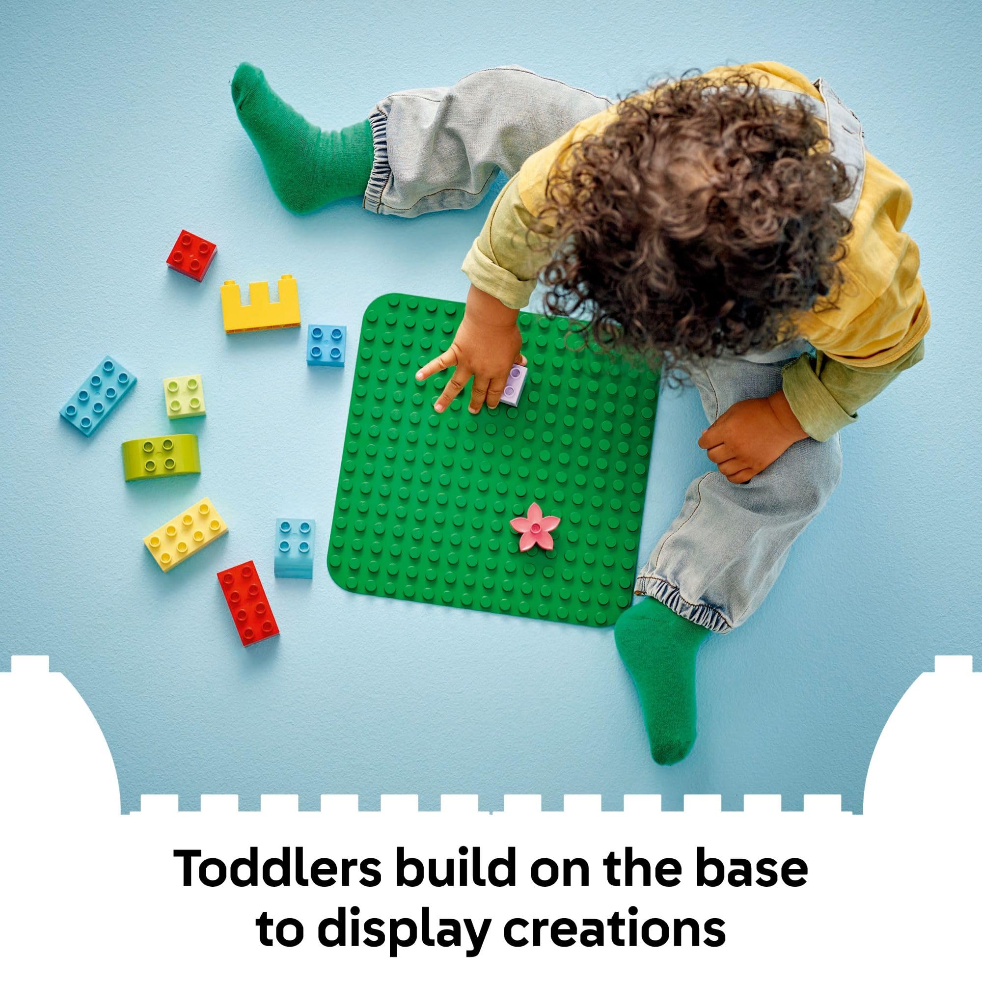 LEGO DUPLO green baseplate with bricks shows easy angle stability for imaginative play.